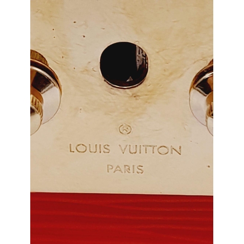 106 - A Louis Vuitton Epi Trunk Clutch Shoulder Bag. Red Epi Leather exterior, featuring black leather cor... 