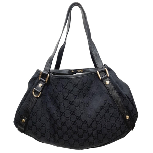 232 - A Gucci Monogram Abbey Shoulder Bag. Black Gucci GG Monogram Canvas Exterior, leather straps, silver... 