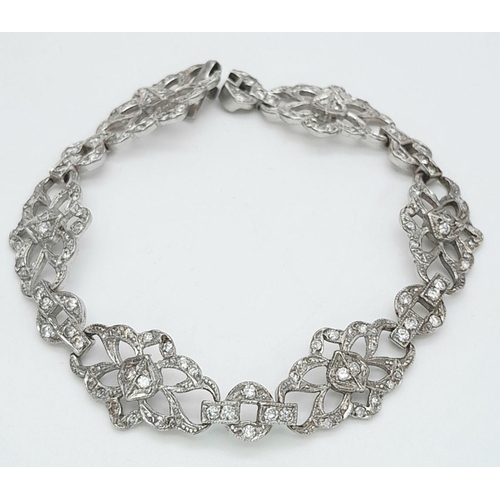 127 - An Art Deco Platinum and Diamond Bracelet. Old cut diamonds - 3ctw. 17.3g total weight. 18cm length.