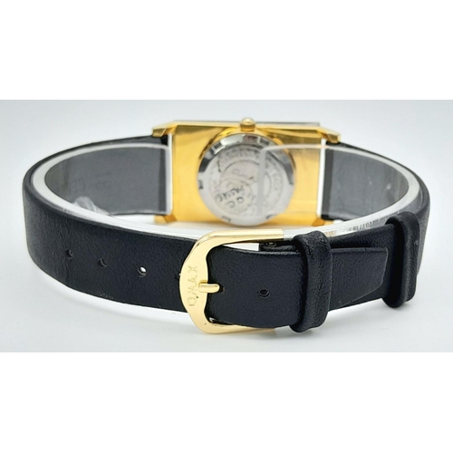 1351 - An Omax Quartz Ladies Watch. Black leather strap. Rectangular gilded case - 23mm. Gilded dial. In wo... 