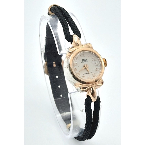 1358 - A Vintage Disu Mechanical 15 Jewels Ladies Watch. Textile strap. Gilded case - 19mm. White dial in w... 