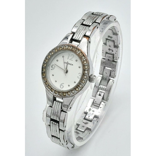 1365 - A Ladies Stone Set Quartz Sekonda Watch. Stainless steel bracelet and case - 24mm. White dial. In wo... 