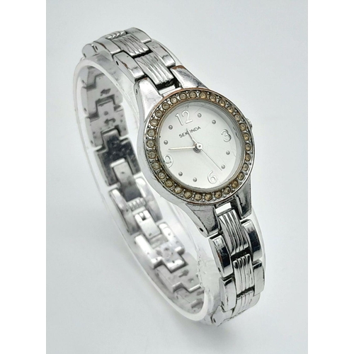 1365 - A Ladies Stone Set Quartz Sekonda Watch. Stainless steel bracelet and case - 24mm. White dial. In wo... 