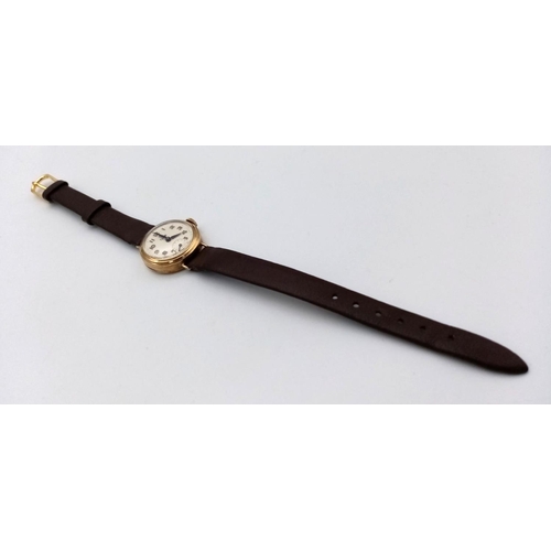 14 - A Vintage 9K Gold Cased Tudor Mechanical Ladies Watch. Brown leather strap. 9k gold case - 21mm. Whi... 