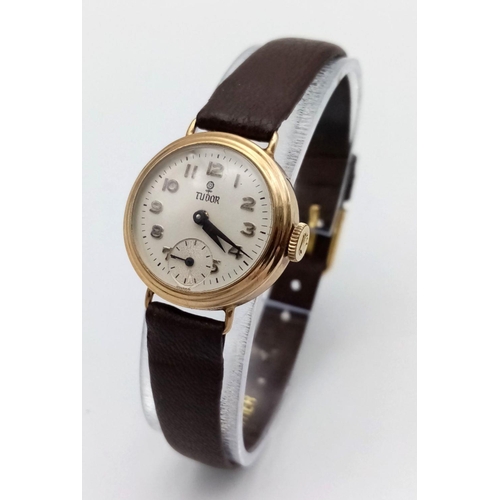 14 - A Vintage 9K Gold Cased Tudor Mechanical Ladies Watch. Brown leather strap. 9k gold case - 21mm. Whi... 