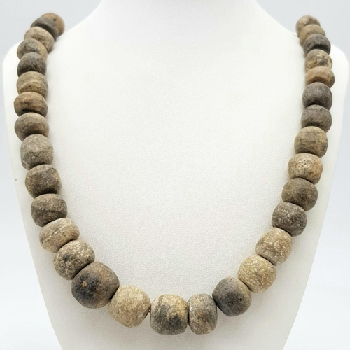 143 - An Ancient Necklace made of Wolly Mammoth Bone Beads! Devensian stage - 120000 - 10000 years ago. 60... 