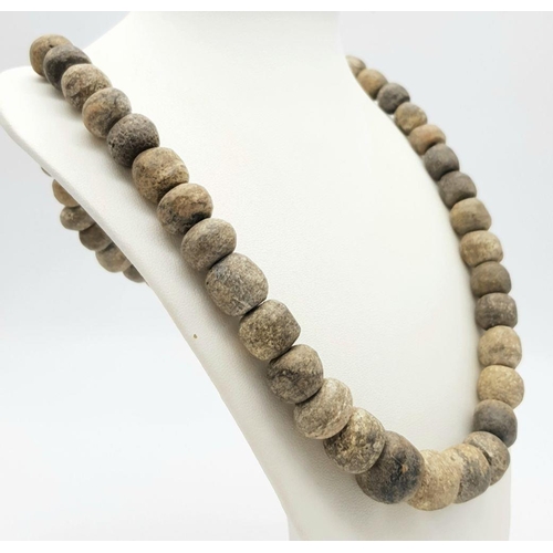 143 - An Ancient Necklace made of Wolly Mammoth Bone Beads! Devensian stage - 120000 - 10000 years ago. 60... 