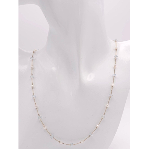 190 - A 9K Yellow Gold Aquamarine and Pearl Necklace. 42cm. 4.5g total weight.