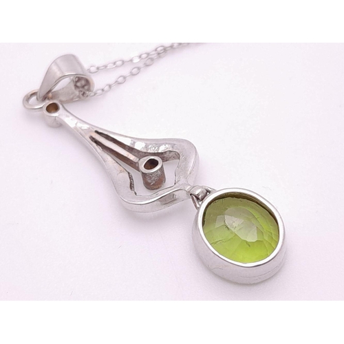 225 - An 18K White Gold Peridot and Diamond Teardrop Pendant on a 9K White Gold Disappearing Necklace. 4cm... 