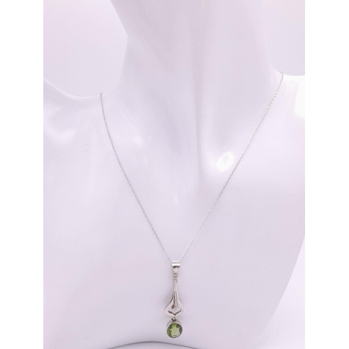 225 - An 18K White Gold Peridot and Diamond Teardrop Pendant on a 9K White Gold Disappearing Necklace. 4cm... 