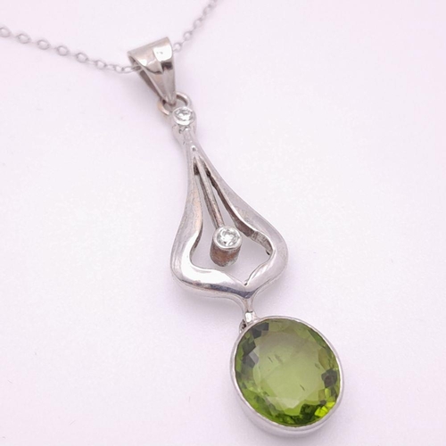 225 - An 18K White Gold Peridot and Diamond Teardrop Pendant on a 9K White Gold Disappearing Necklace. 4cm... 