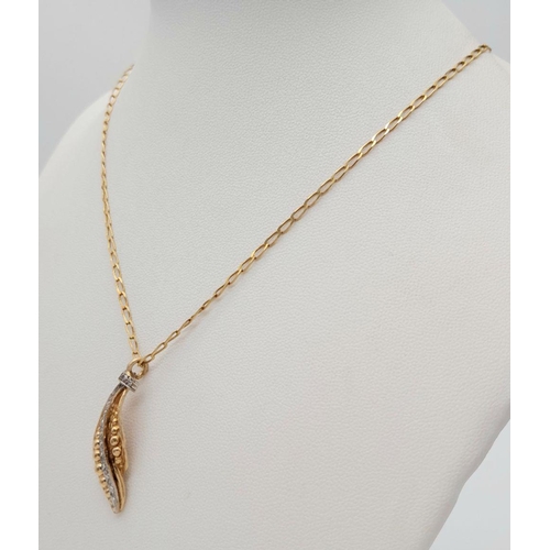 239 - An 18K Gold Necklace with a Hanging Leaf Form Pendant - A Line of Diamonds Separating Graduated Gold... 