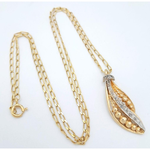 239 - An 18K Gold Necklace with a Hanging Leaf Form Pendant - A Line of Diamonds Separating Graduated Gold... 