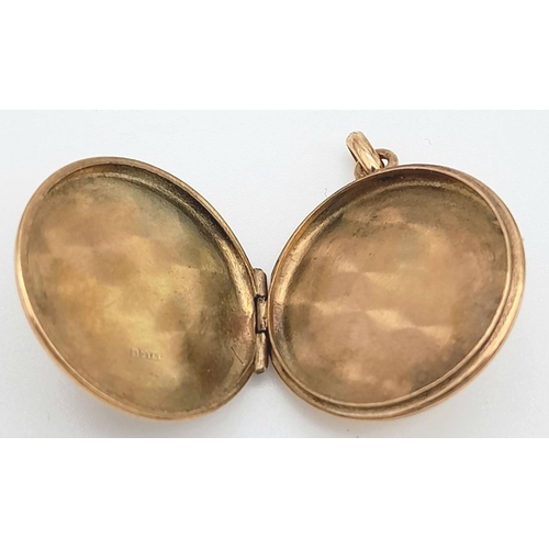 240 - A Vintage 9K Yellow Gold Locket Pendant. 2cm diameter. 2.35g weight.