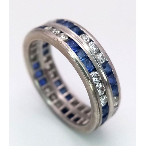 323 - A Stylish 18K White Gold Diamond and Sapphire Full Eternity 
Two Row Ring. Alternating three diamond... 