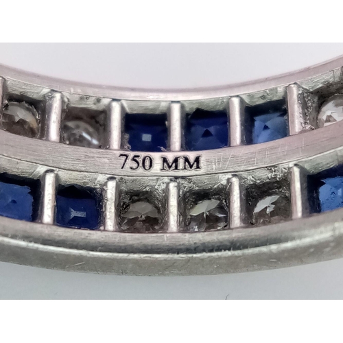 323 - A Stylish 18K White Gold Diamond and Sapphire Full Eternity 
Two Row Ring. Alternating three diamond... 