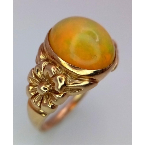 344 - A 9K Yellow Gold Opal Cabochon Ring. Wonderful colour-play. Size Q. 3.96g total weight.