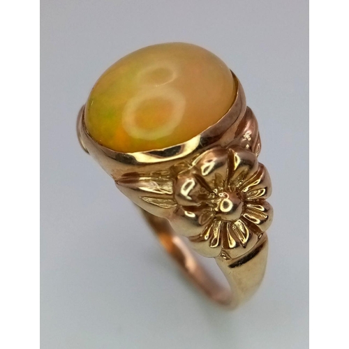 344 - A 9K Yellow Gold Opal Cabochon Ring. Wonderful colour-play. Size Q. 3.96g total weight.