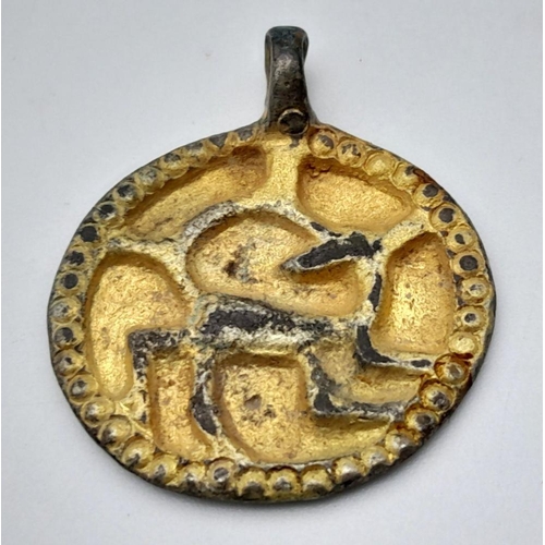 373 - An Ancient Viking Age Gilded Silver Decorative Animal Pendant. Circa 9th -11th century AD. 3cm. From... 