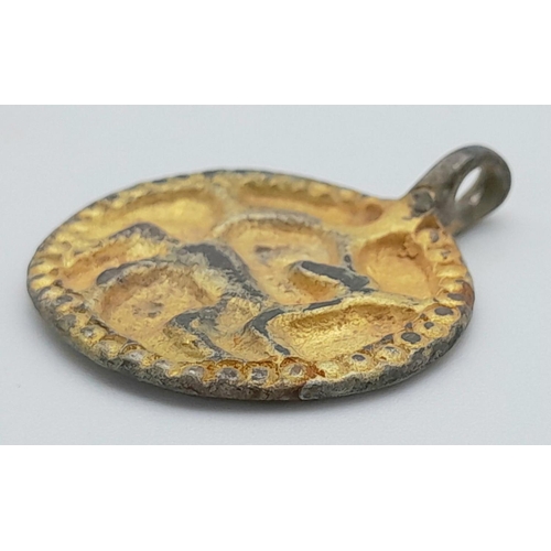 373 - An Ancient Viking Age Gilded Silver Decorative Animal Pendant. Circa 9th -11th century AD. 3cm. From... 