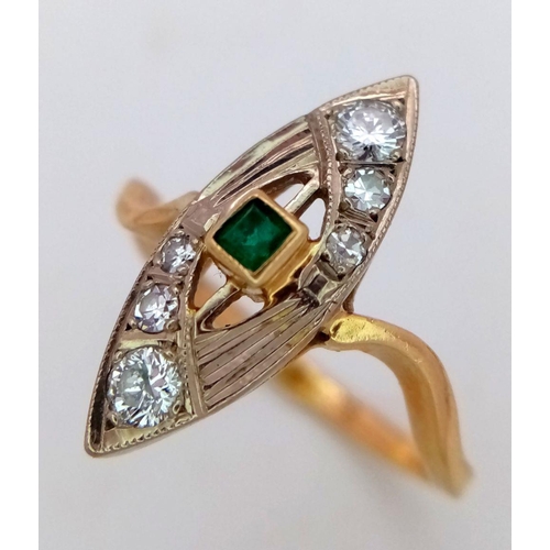 379 - A Beautiful 18K Yellow Gold, Diamond and Emerald Marquise Shaped Ring. Central emerald with graduati... 