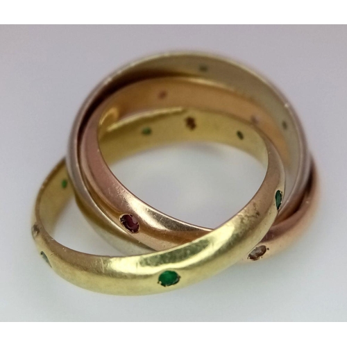 386 - An 18K Yellow Gold, Diamond, Ruby and Emerald Russian Wedding Ring. Each ring having six set gemston... 