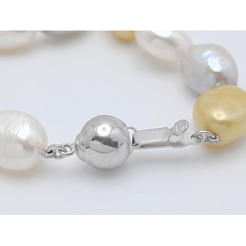 428 - A Small Baroque Shaped Gold, Silver and White Pearl Necklace. 925 clasp. 44cm.