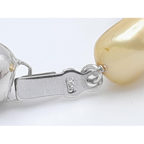 428 - A Small Baroque Shaped Gold, Silver and White Pearl Necklace. 925 clasp. 44cm.