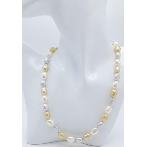 428 - A Small Baroque Shaped Gold, Silver and White Pearl Necklace. 925 clasp. 44cm.