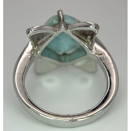 449 - A Turquoise Cabochon 925 Silver Floral Ring. Size O. Weight - 6.6g. HV2303