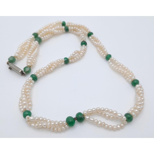 498 - A Three Row Seed Pearl Necklace with Emerald Spacers. 40cm.