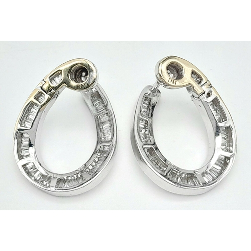 512 - A Stunning Pair of 18K White Gold and Diamond Twisted Horse Shoe Earrings. DM makers mark. 3ctw of b... 