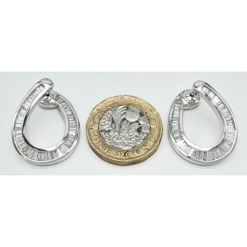 512 - A Stunning Pair of 18K White Gold and Diamond Twisted Horse Shoe Earrings. DM makers mark. 3ctw of b... 