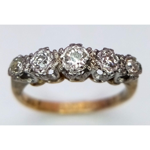 526 - An 18K Yellow Gold and Platinum Five Stone Diamond Ring. 
Size N. 3.3g total weight.