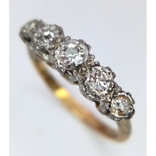 526 - An 18K Yellow Gold and Platinum Five Stone Diamond Ring. 
Size N. 3.3g total weight.