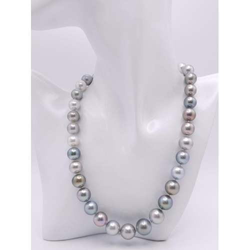 99 - A Mesmerising Tahitian Pearl Necklace. Different shades of greys and silvers. Diamond encrusted glit... 