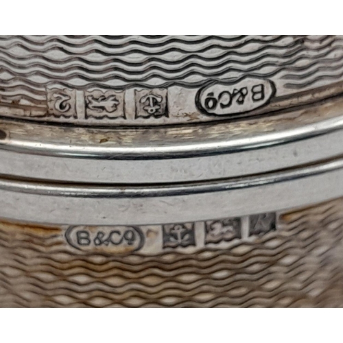1356 - A Pair of Hallmarked 1966 Engine Turned Decoration Silver Napkin Rings. 19.72 Grams.