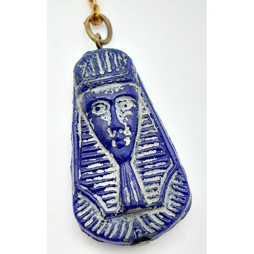 1370 - An Egyptian Pressed Blue Glass Pendant in the Shape of Tutankhamun on a 46cm Rolled Gold Chain. Pend... 