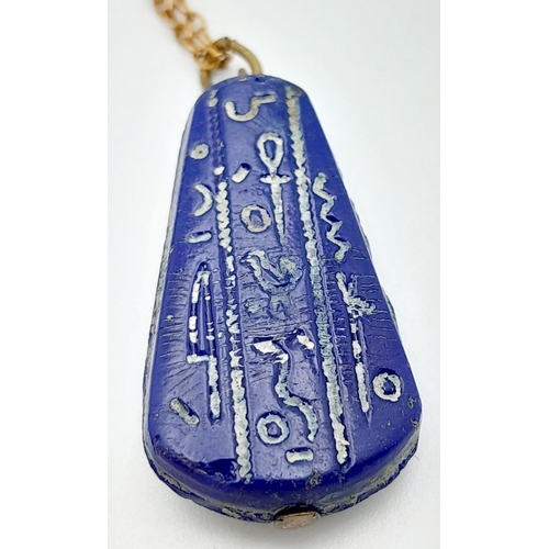 1370 - An Egyptian Pressed Blue Glass Pendant in the Shape of Tutankhamun on a 46cm Rolled Gold Chain. Pend... 