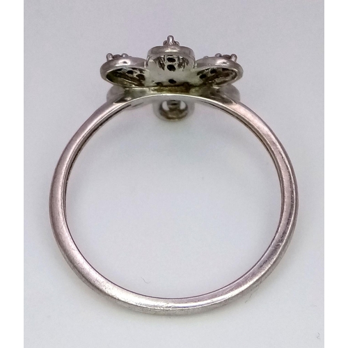 1371 - A Limited Edition Sterling Silver and Champagne Diamond Flower Design Ring. Size R. Set with 0.15 Ca... 