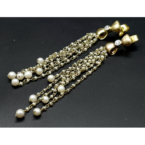 106 - A pair of Vintage 18K Yellow Gold Tahitian Pearl and Diamond Drop Earrings. Six strands of petit pea... 