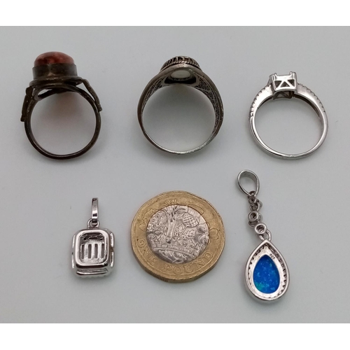 1373 - An Eclectic Mix of Silver Jewellery - three rings, two pendants and one chain necklace. One stone mi... 