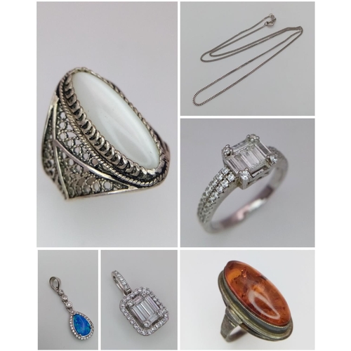 1373 - An Eclectic Mix of Silver Jewellery - three rings, two pendants and one chain necklace. One stone mi... 