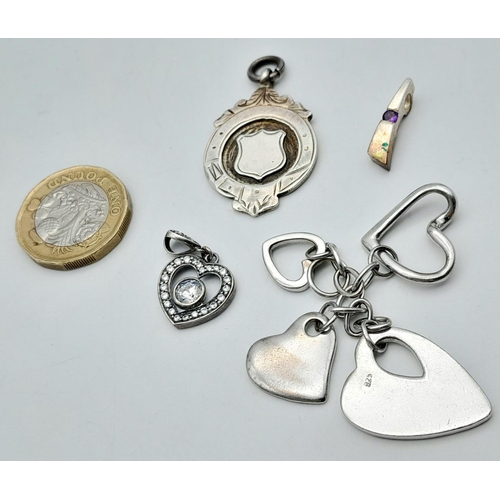 1395 - Four Silver Pendants - Various styles and designs. Please see photos for details. 23.28g total weigh... 