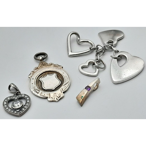 1395 - Four Silver Pendants - Various styles and designs. Please see photos for details. 23.28g total weigh... 