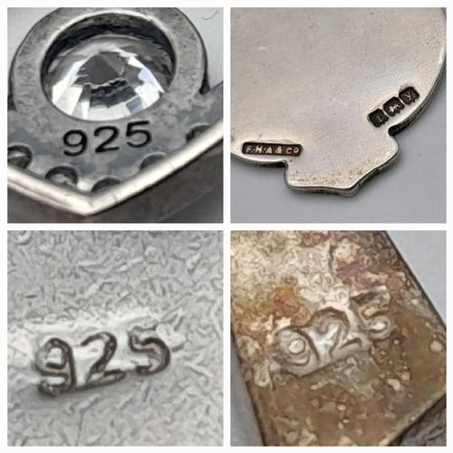 1395 - Four Silver Pendants - Various styles and designs. Please see photos for details. 23.28g total weigh... 