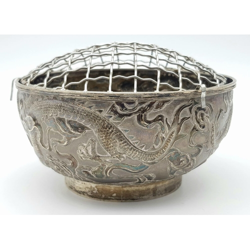 1396 - A late 19th, early 20th century small silver bouquet pot with dragon motif design by Wang Hing & Com... 