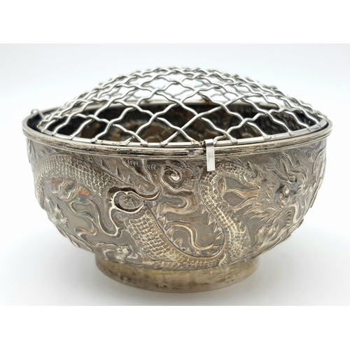 1396 - A late 19th, early 20th century small silver bouquet pot with dragon motif design by Wang Hing & Com... 