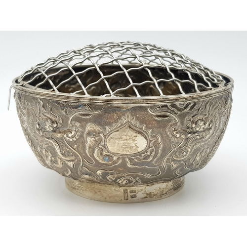 1396 - A late 19th, early 20th century small silver bouquet pot with dragon motif design by Wang Hing & Com... 