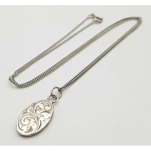 1402 - Three 925 Silver Necklaces - angel, owl and oval pendant. 10.44g total weight.